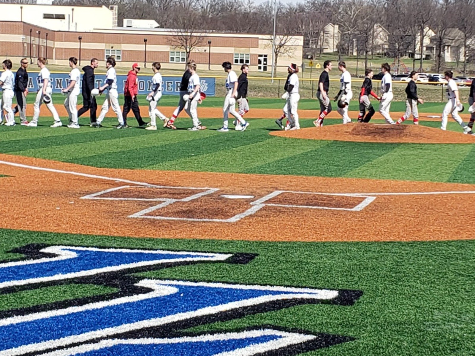 Leavenworth and Tonganoxie shake hands after game 2 of the jamboree.